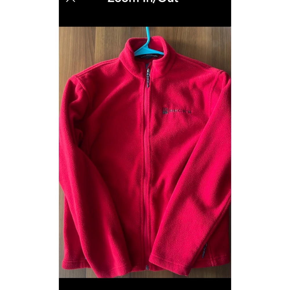 Red fleece jacket with zip up pockets